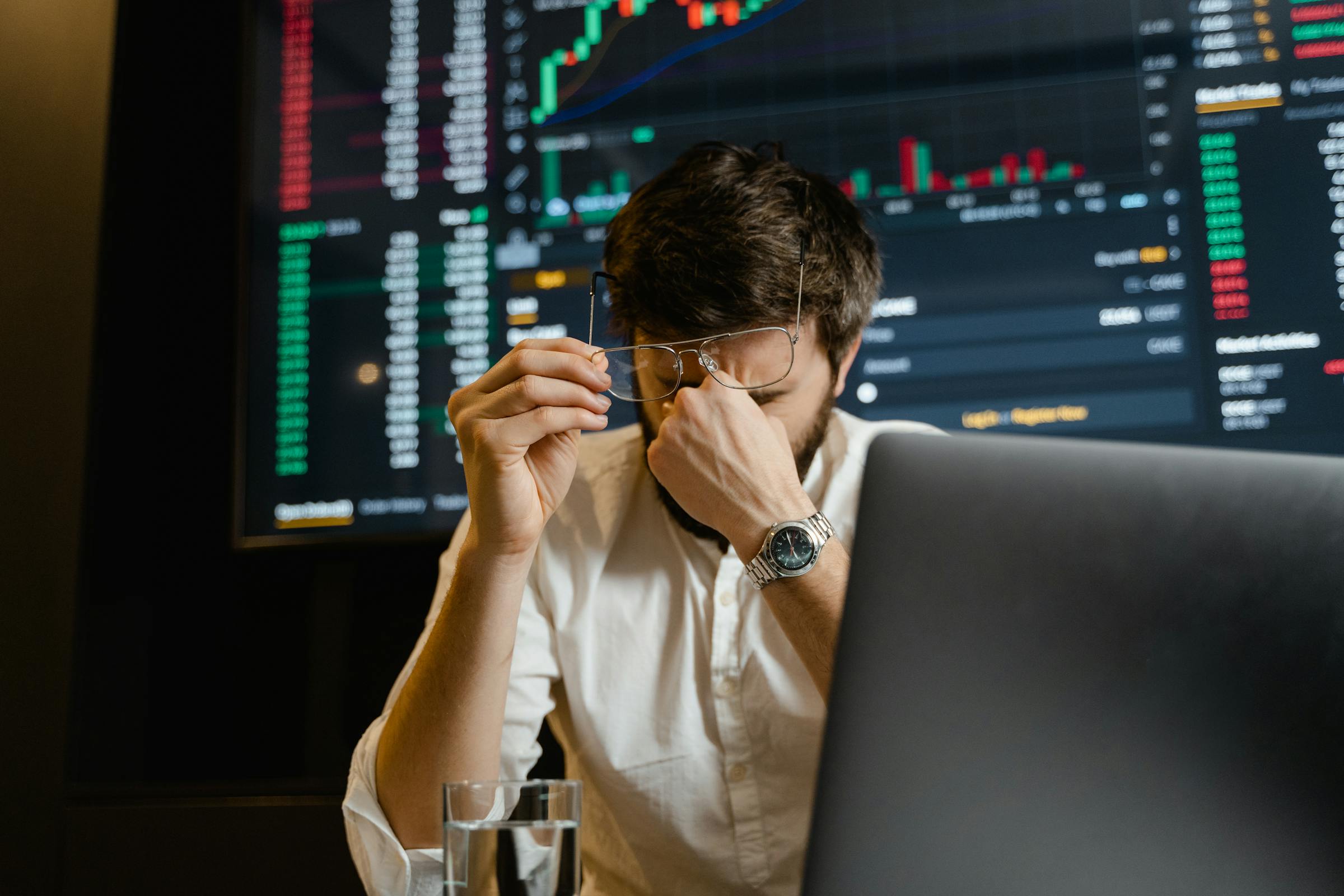 Trader in front of live charts